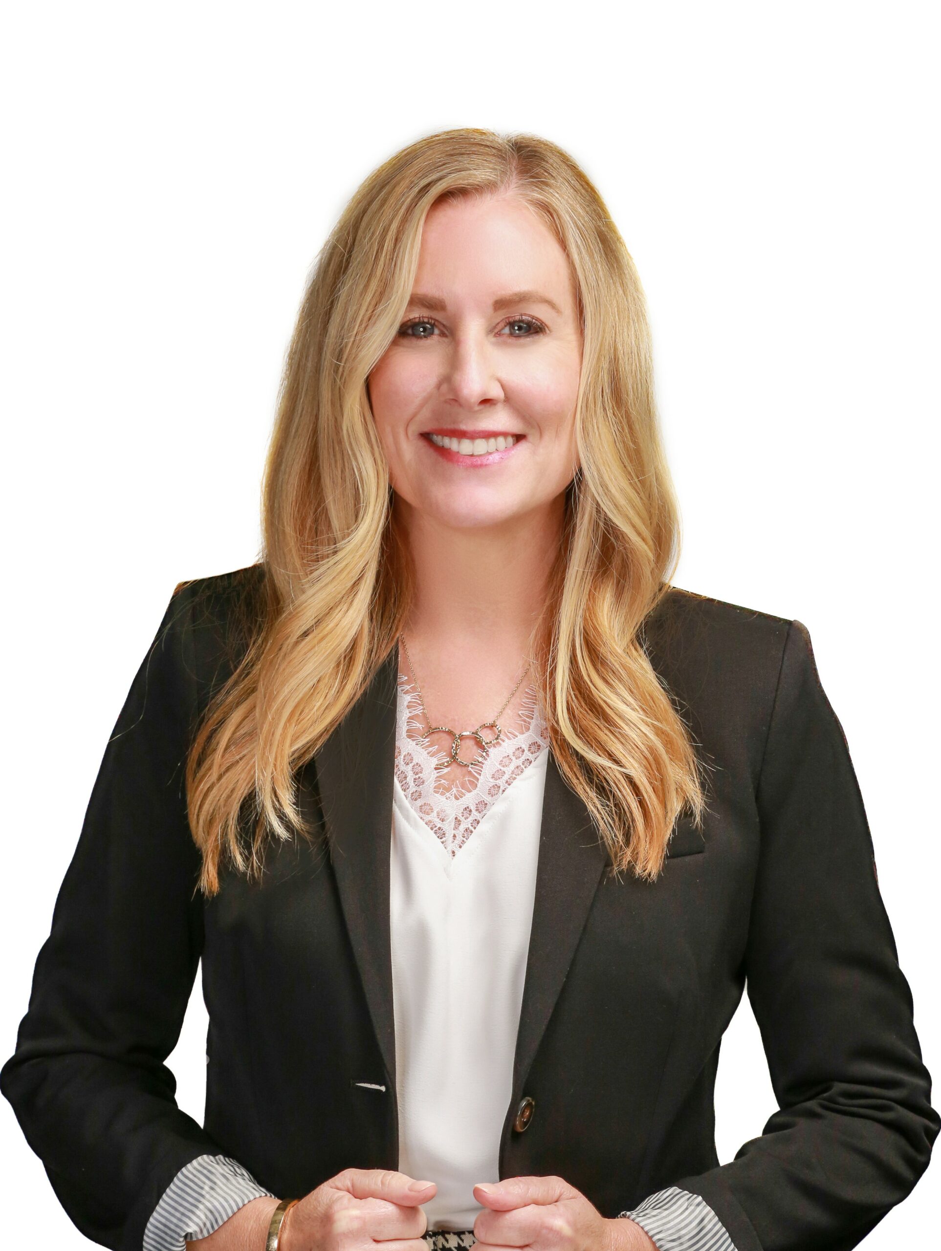 A smirking woman wearing business attire