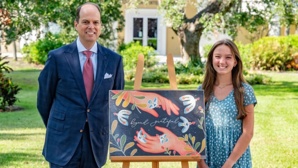 Michael J. Wilson, the president of Williams Parker Attorneys at Law is seen here with Ringling Illustration student and contest winner Sky Chandler.