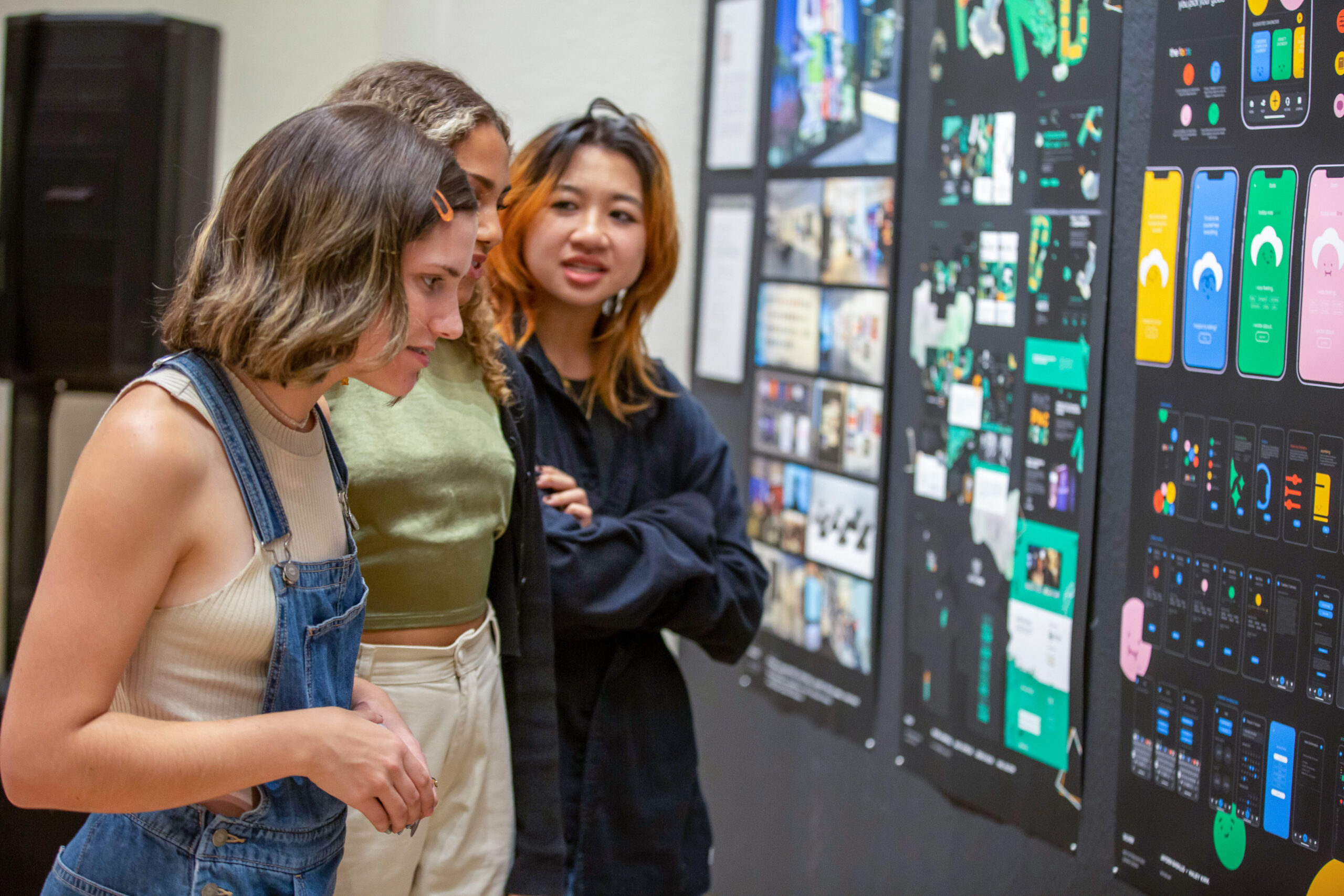 Ringling Students admiring the work their peers at the Best of Ringling Exhibition.