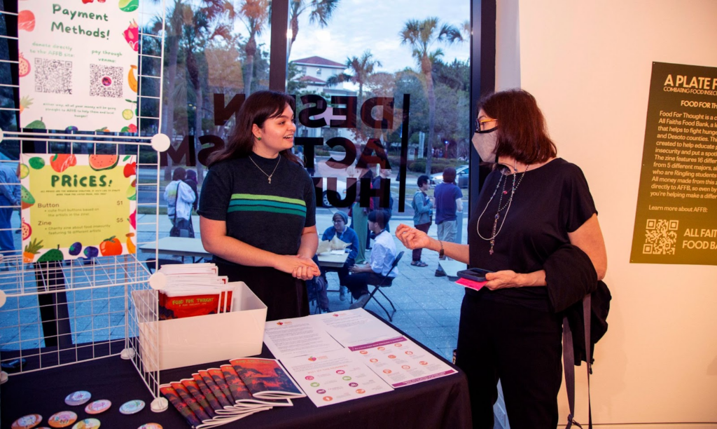 Bowers sold copies of Food for Thought: a Food Insecurity Zine and buttons at a Ringling College Galleries Art Walk on Jan. 20, 2023, to raise money for All Faiths Food Bank.