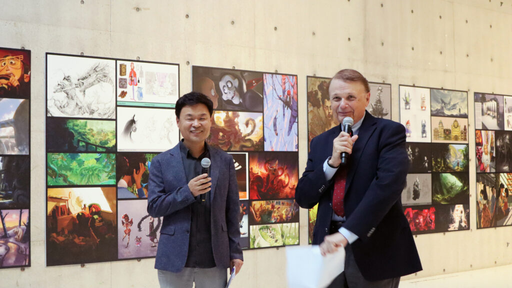 Ringling faculty member Seongwoo Nam (left) and Dr. Larry R. Thompson, president of Ringling College of Art and Design, presented at the Ringling College exhibition hosted by Seoul Institute of the Arts in South Korea.