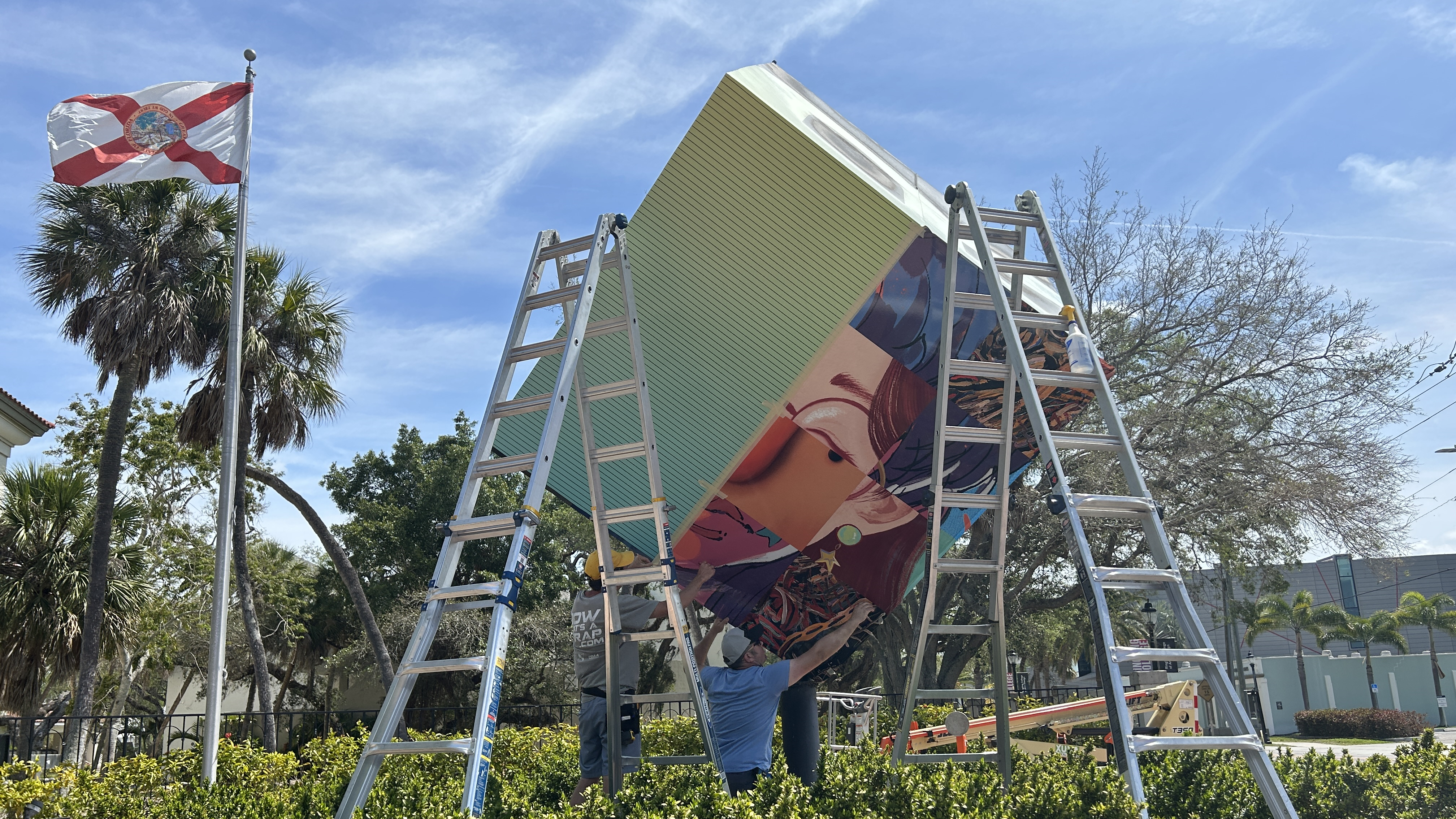 Workers install the new Ringling Cube design at Ringling College.