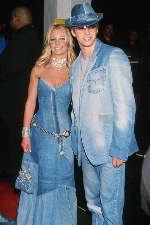 2000s couple wearing coordinated denim formalwear at an event
