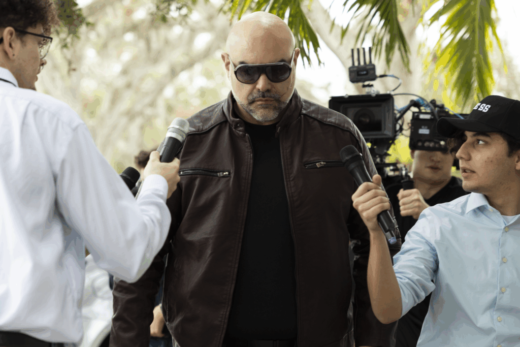 Behind the scenes man with reporters