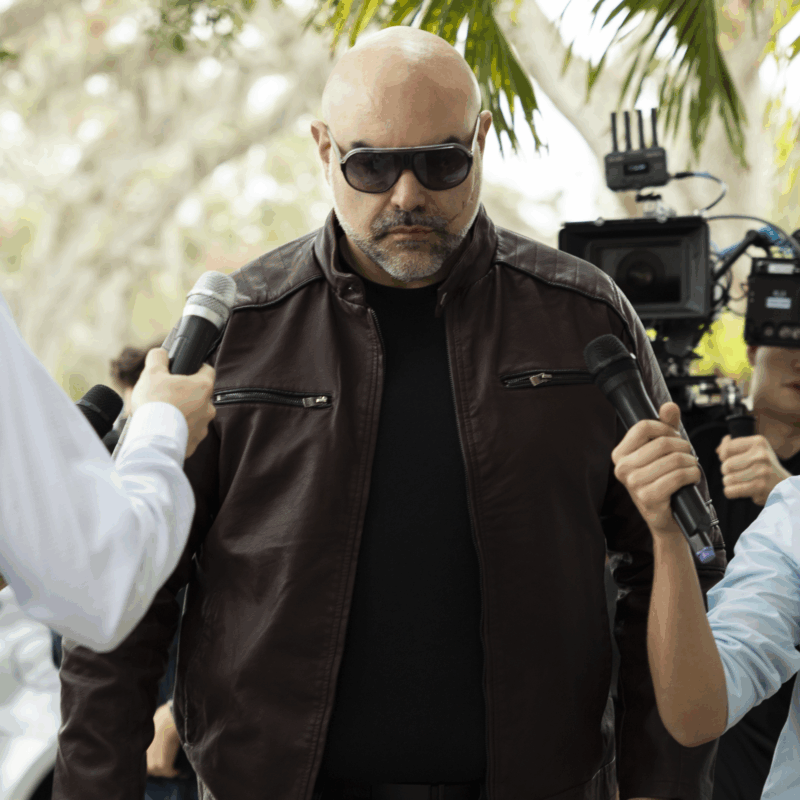 Behind the scenes man with reporters