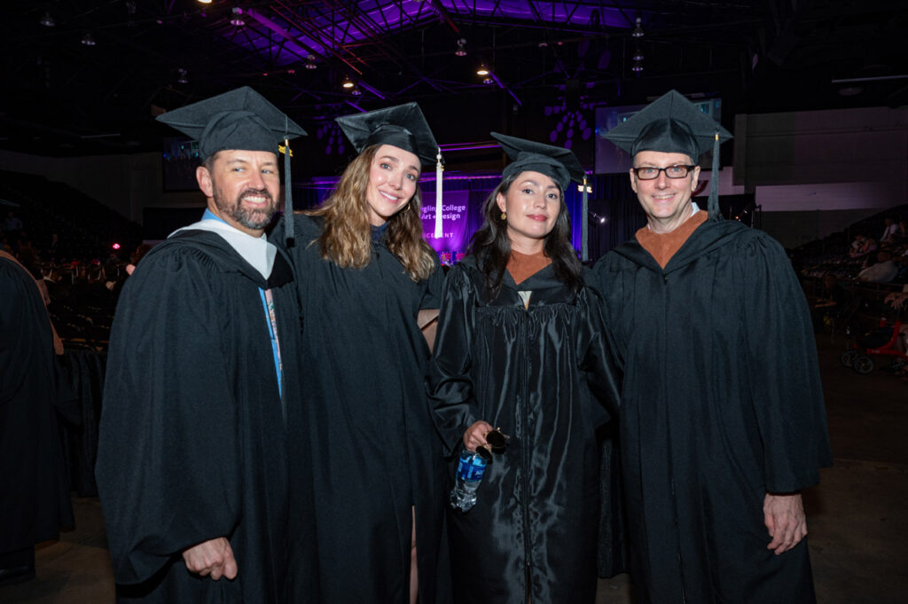 Faculty and Graduates Faculty and graduates posing together at commencement.